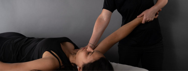 Woman receiving kinesiology treatment