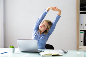 Women stretching at the desk